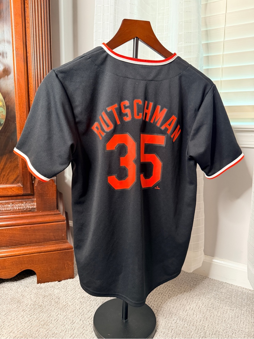 Genuine Merchandise Black Jersey with Orange Name & Number 35